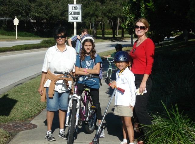 Moms and kids biking